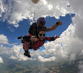 A tandem skydive into the clouds	