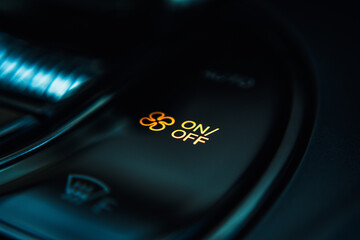 Close-up view of an electric vehicle's center console, showcasing the control panel, which...
