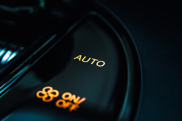 Close-up view of an electric vehicle's center console, showcasing the control panel, which...