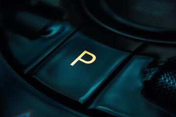 Close-up view of an electric vehicle's center console, showcasing the control panel, which...