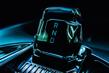 Close-up view of an electric vehicle's center console, showcasing the control panel, which...