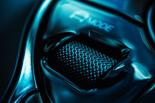 Close-up view of an electric vehicle's center console, showcasing the control panel, which highlights the gear selector along with the start-stop ignition, parking mode, and emergency hazard lights