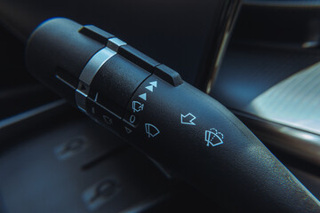 Close-up view of an electric vehicle's center console, showcasing the control panel, which...