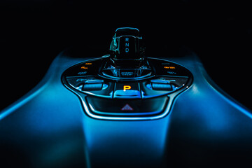 Close-up view of an electric vehicle's center console, showcasing the control panel, which...