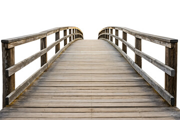 Obraz premium Curved wooden bridge with rustic railings leading upward in arched design, isolated on a transparent background