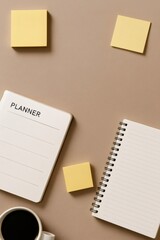Flat lay of notebooks, planner, sticky notes and a cup of coffee on a minimal brown background, perfect workspace for planning and organizing
