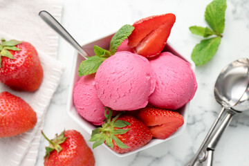 Refreshing sorbet, strawberries and mint in bowl on white marble table, flat lay
