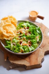 salad with peanut sauce named asinan Betawi in Bahasa 