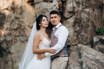 bride blonde girl and groom near the river