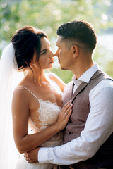 bride blonde girl and groom near the river