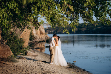 bride girl and groom near the river