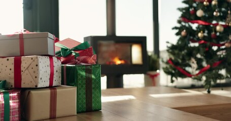 Christmas, gifts and fireplace in living room of home for festive celebration or tradition. Background, interior and wrapped presents on floor in empty apartment for December holiday or winter season - Powered by Adobe
