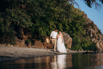 bride girl and groom near the river