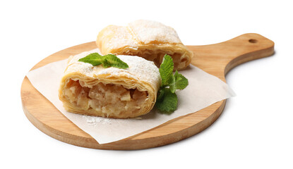 Pieces of tasty apple strudel with powdered sugar and mint isolated on white