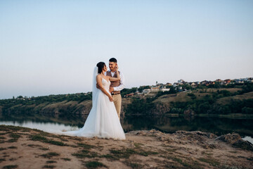 bride girl and groom near the river