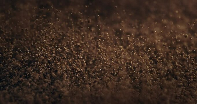 Close-Up of Fresh Ground Coffee in Slow Motion Aromatic Brown Granules, Rich Texture, and Bold Roast Perfect for Morning Rituals, Espresso Shots, and Caffeine-Lovers' Visual Inspiration at 1000 fps