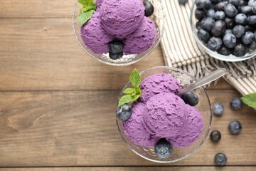 Tasty sorbet with blueberries and mint in dessert bowls on wooden table, flat lay. Space for text