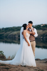 bride girl and groom near the river