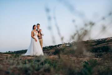 bride girl and groom near the river