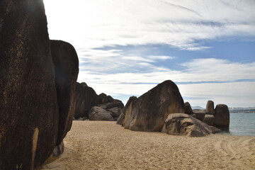Rock formations on the beach at dusk