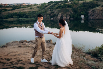 bride girl and groom near the river