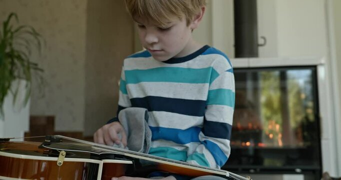 Caucasian Kid Play Mandolin at Home. European Boy Practice Music 4K 10-bit