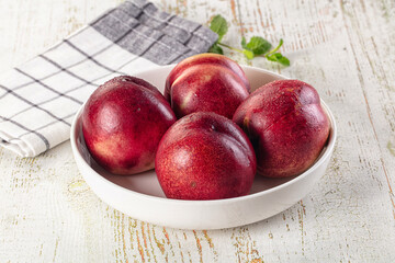 Ripe sweet juicy nectarines heap