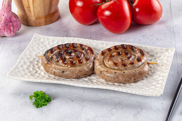 Grilled beef round circle sausages