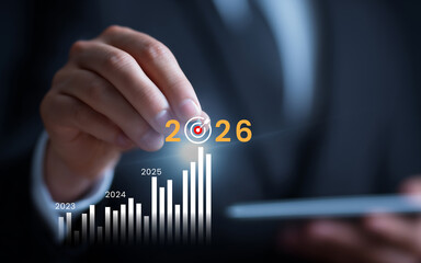 Businessman pointing at future growth forecast and target for 2026