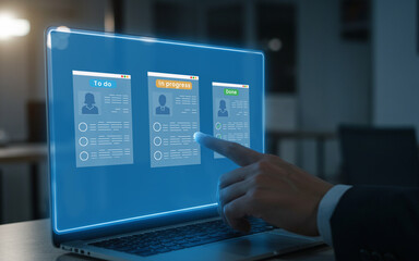 Businessman interacting with a digital project management board on a laptop