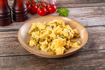 Scrambled egg omelet with green peas