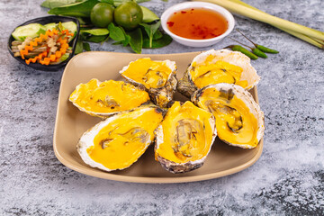 Baked oyster with cheddar cheese