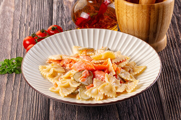 Italian pasta farfalle with salmon