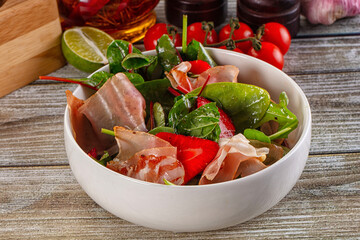 Salad with jamon, strawberry and arugula