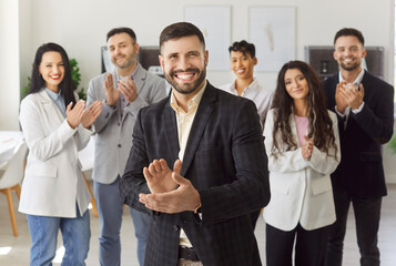 Happy leader and corporate company employees team celebrate success of deal and business growth....