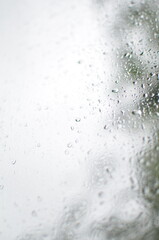 Rain drops on window, blurred background