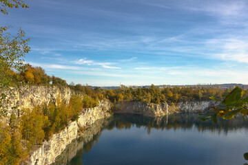 Autumn Landscape. A lake with steep steep banks and yellow trees on a sunny autumn day.