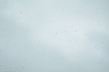Rain drops on window, blurred background