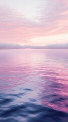 Obraz premium Canister spray substance A serene sunset reflecting on calm waters, showcasing shades of pink and purple in a tranquil atmosphere.