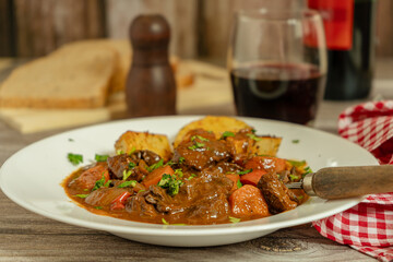 Delicious beef stew with vegetables and wine