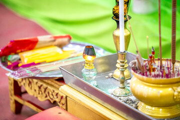 Close-up background of a water jar used in religious ceremonies, pouring water, and dedicating merit to the dead according to religious rites.