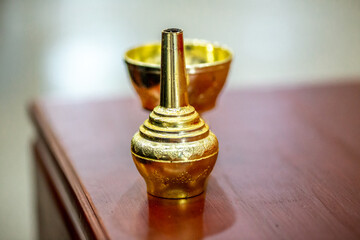 Close-up background of a water jar used in religious ceremonies, pouring water, and dedicating merit to the dead according to religious rites.