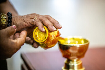 Close-up background of a water jar used in religious ceremonies, pouring water, and dedicating merit to the dead according to religious rites.