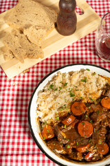 Hearty beef stew with rice and rustic bread