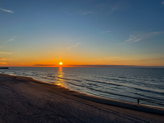 Sunset on the beach in May on the Baltic Sea in the Mrzezyno region in Poland