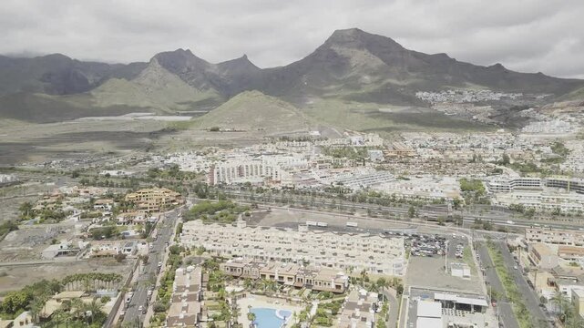 Drone facing Mount Teide lowers over Duque Park in Costa Adeje, Tenerife, Canary Islands, Spain