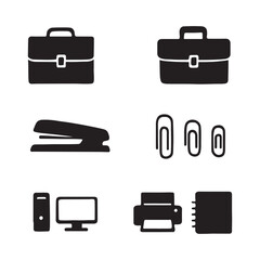 Office supplies including briefcases stapler paper clips computer printer and notebook