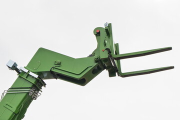 Forklift loader or stacker. Part of hydraulic and pneumatic mechanism in machine. Technology in...