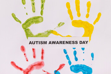 Kids handprint made of paint and inscription Autism Awareness Day. Autism Disorder
