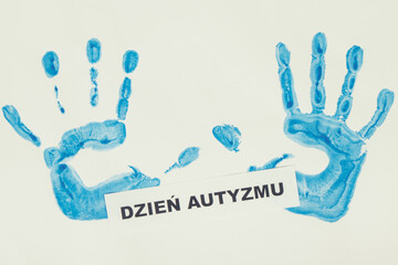 Kid handprint made of paint and polish inscription Autism Day. Autism Spectrum Disorder